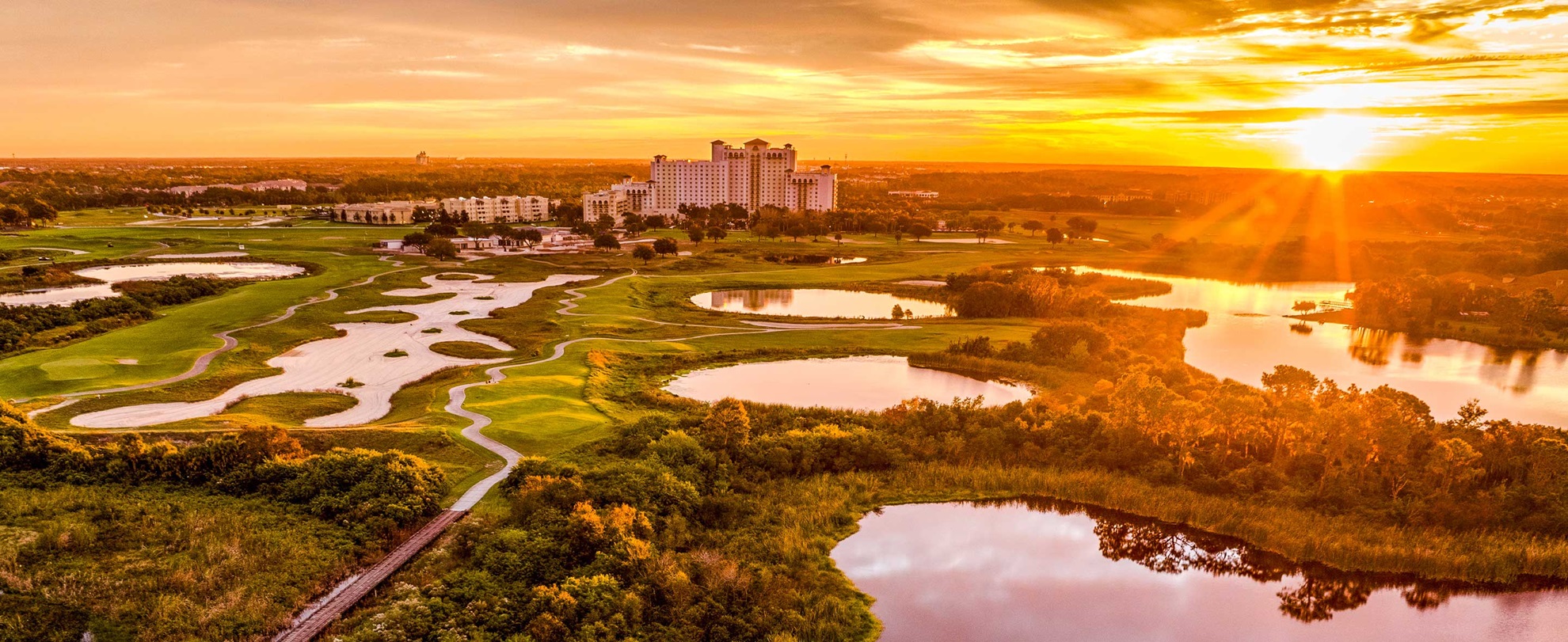 Sunset view of Omni Orlando Resort at Championsgate